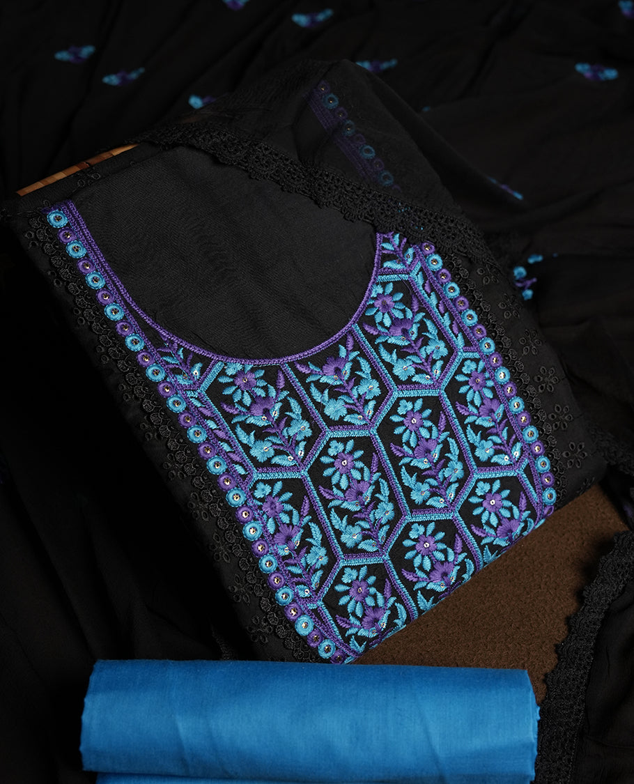 Black colour hakoba churidhar material featuring beautiful blue and violet colour floral embroidery on the neckline and front panel, highlighted with lace detailing & Comes with an embroidered dupatta and contrast blue colourbottom.