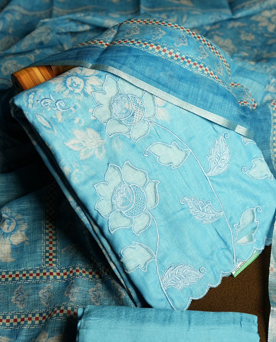 Blue colour churidhar material featuring floral and cutwork embroidery on the front panel, digital floral printed dupatta with elegant border, and matching plain bottom.