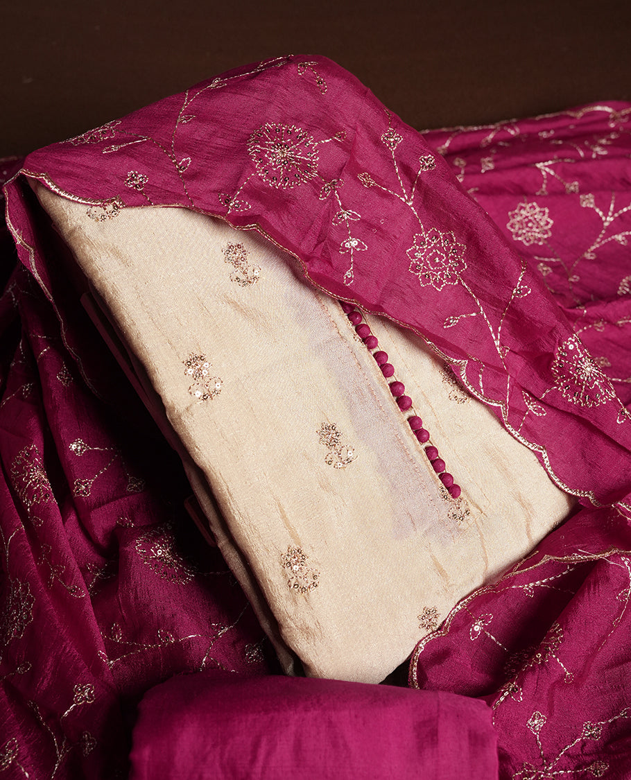 Golden Cream colour churidhar material featuring thread embroidery on the front panel, contrast maganta colour dupatta with elegant border, and matching plain bottom