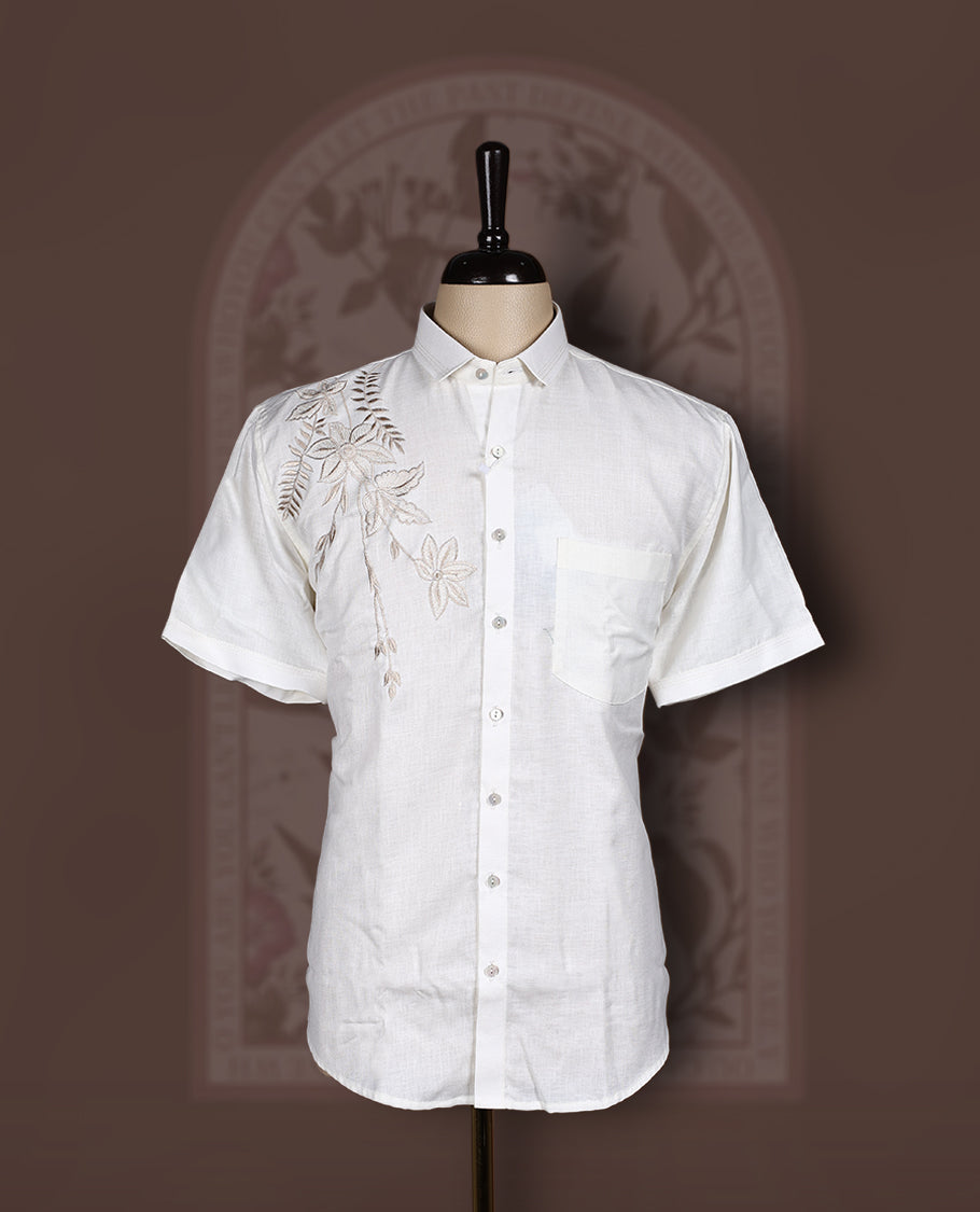 Off White colour cotton linen shirt featuring delicate embroidery work on the shoulder, designed with a mandarin collar and short sleeves for a refined yet comfortable style.