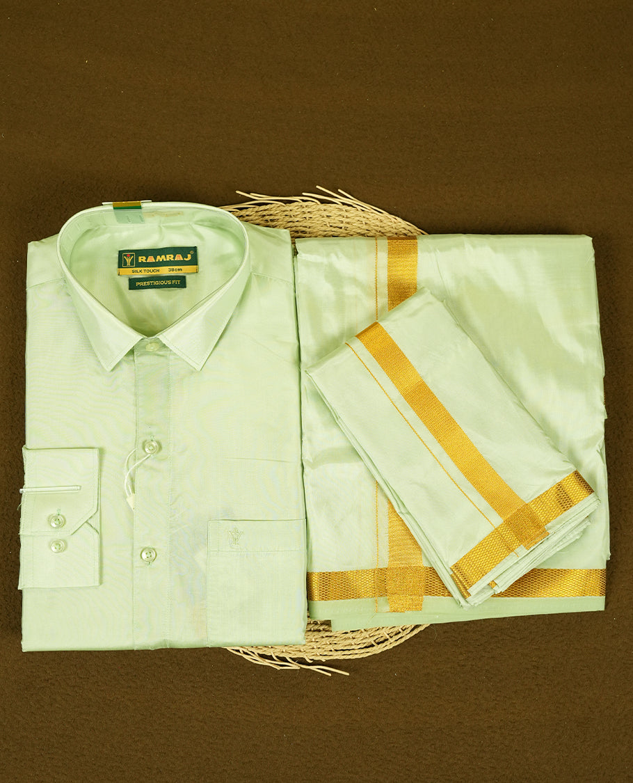 RAMRAJ Light Green Colour kurtha paired with a Light Green dhoti and a Light Green towel, elegantly finished with a matching Gold border.
