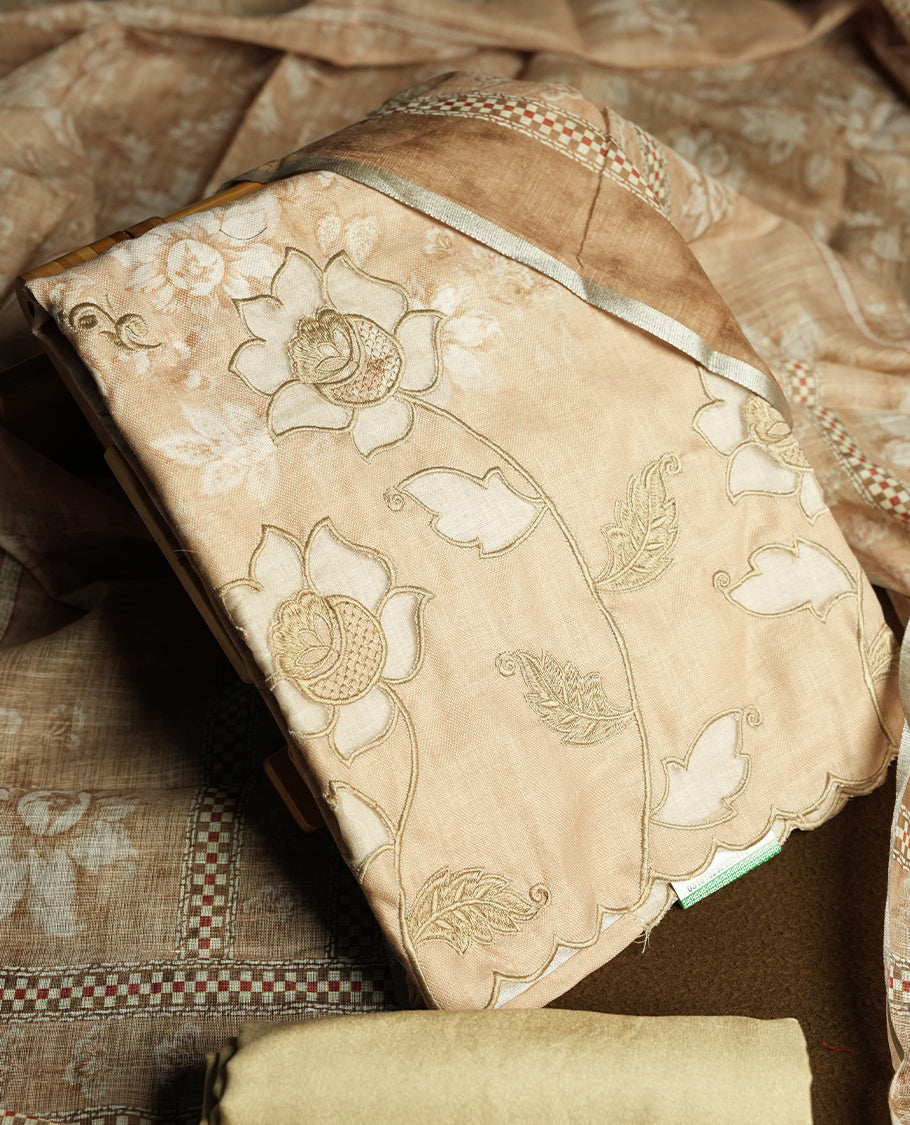 Beige colour churidhar material featuring floral and cutwork embroidery on the front panel, digital floral printed dupatta with elegant border, and matching plain bottom.