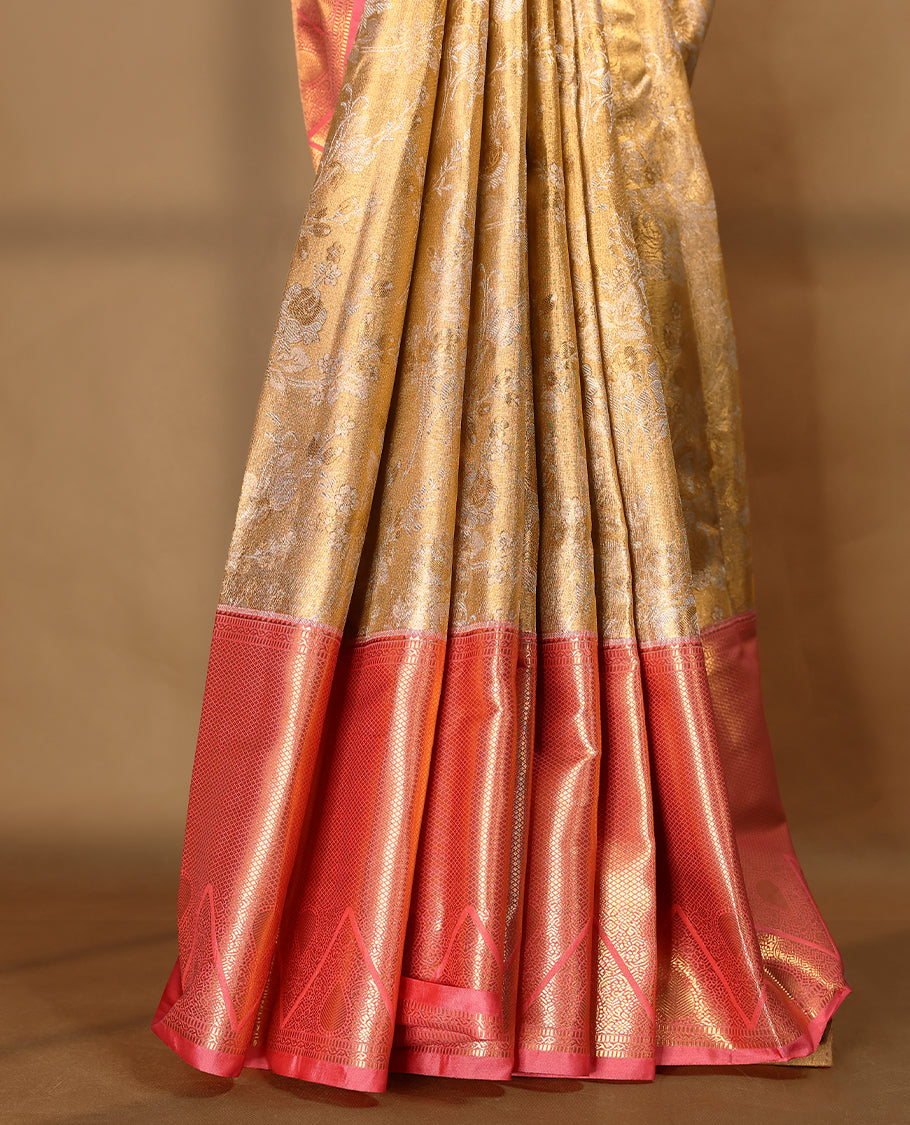 Gold colour tissue brocade saree with gold and silver zari floral pattern on body, gold zari traditional Piramide & thilakam work Blush Pink border, rich matching pallu with Antique zari motifs, paired with matching blouse.