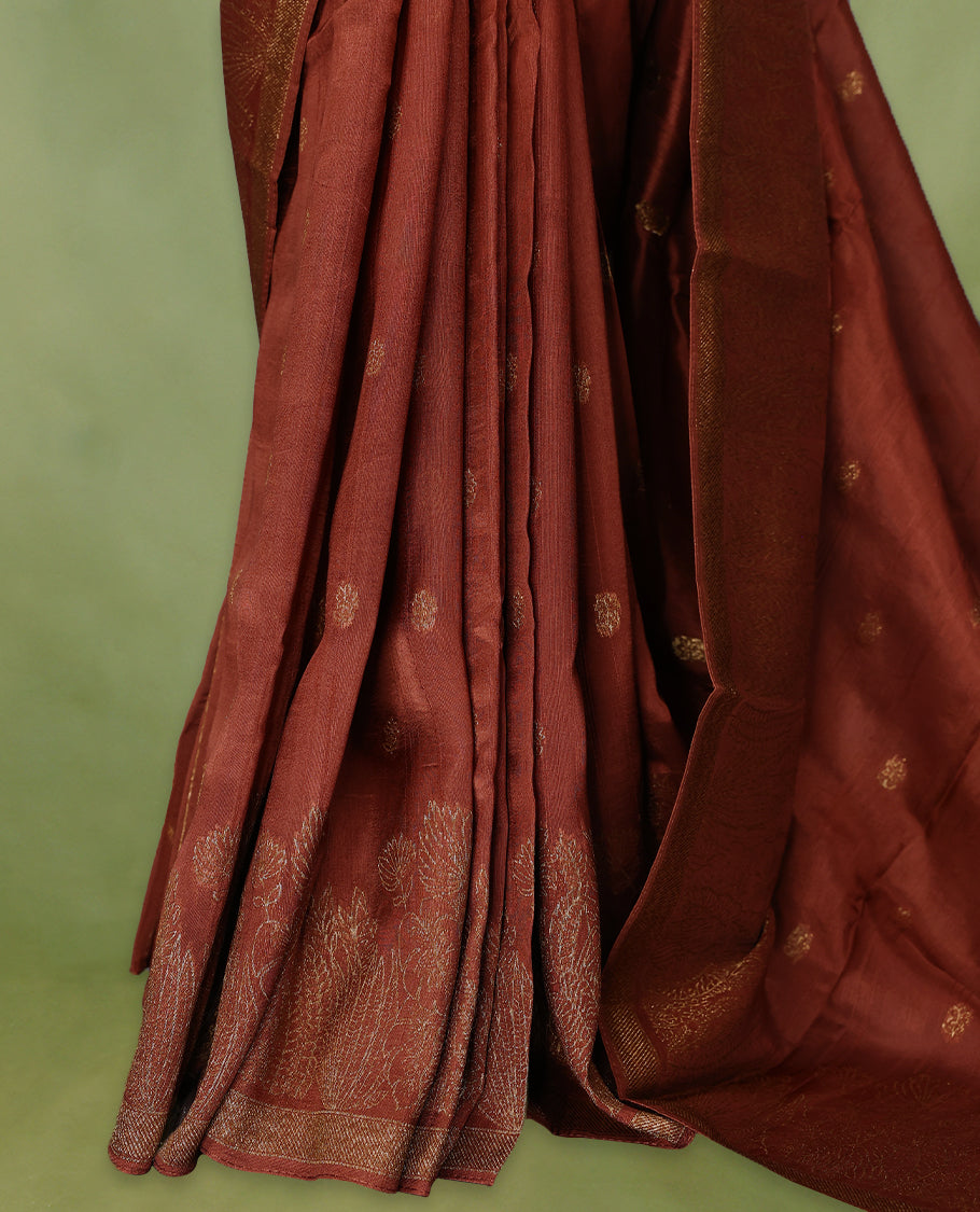 Rust Orange semi-Banaras tussar georgette saree adorned with antique zari floral motifs on the body, beautifully highlighted with a pencil art garden-inspired border, paired with a matching blouse.