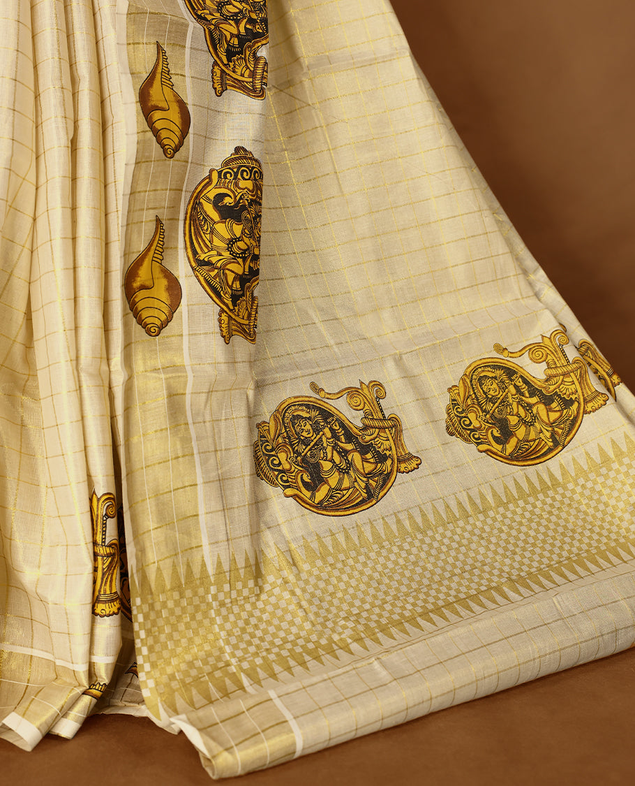 Light Gold colour Tissue Kerala saree featuring Lord Krishna and peacock motifs on the body, golden zari checks, and a beautifully woven border with shell Printed motifs, paired with a matching blouse perfect for festive occasions.