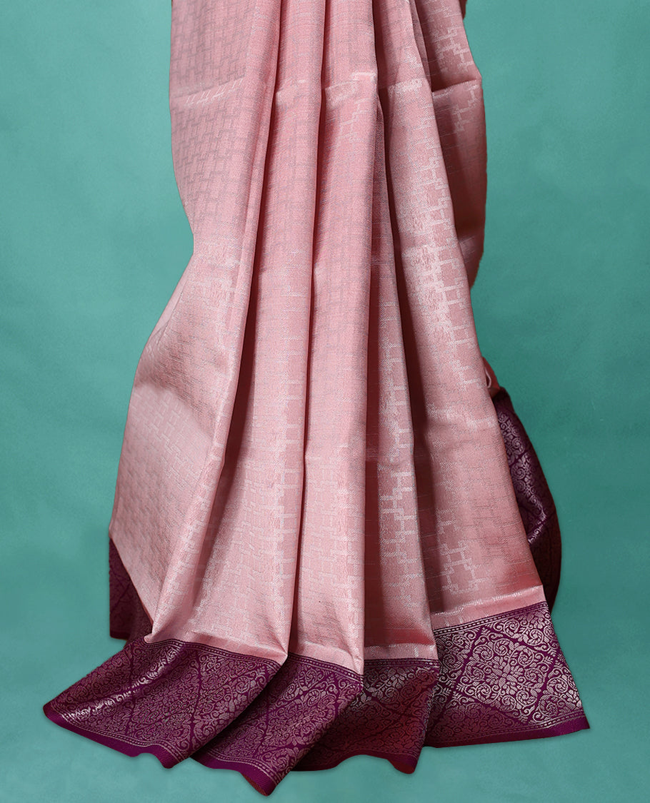 Light Pastel Onion coloured semi silk saree featuring a Zari design on the body, paired with a Grape coloured border and matching blouse.