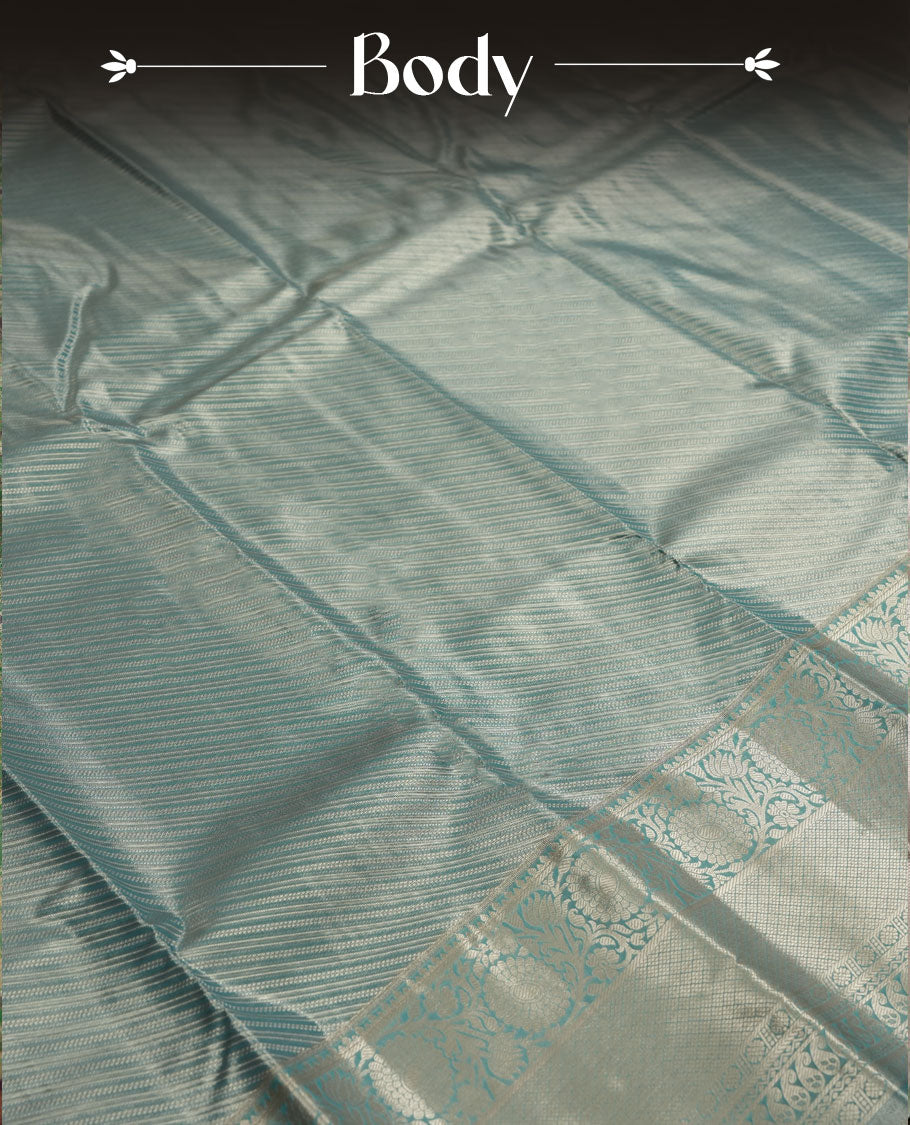 Aqua blue colour and Antique gold Zari Tissue Brocade Saree features intricate line Motifs on body and traditional border & pallu with floral patterns, paired with matching blouse