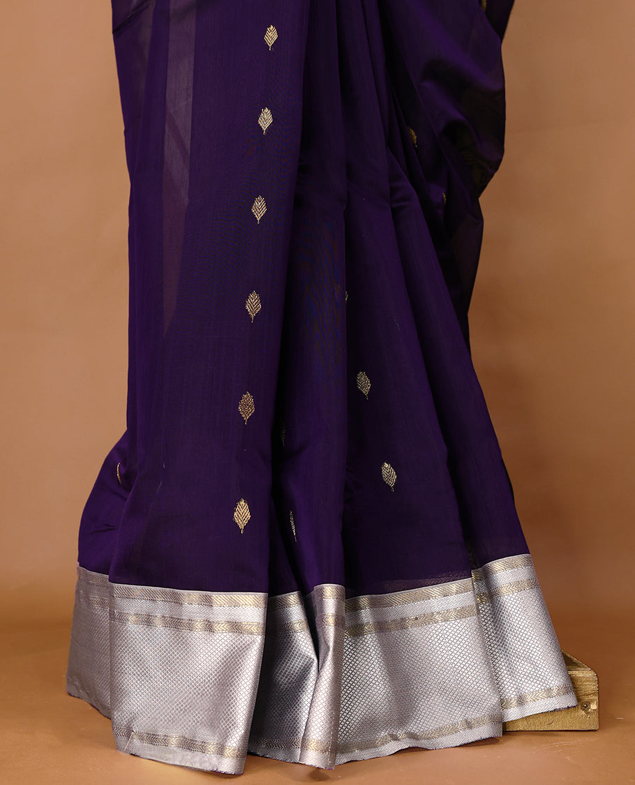 Purple coloured Maheshwari Cotton saree featuring Antique Zari Leaf motifs across the entire body, complemented by a traditional White coloured border and a matching blouse.