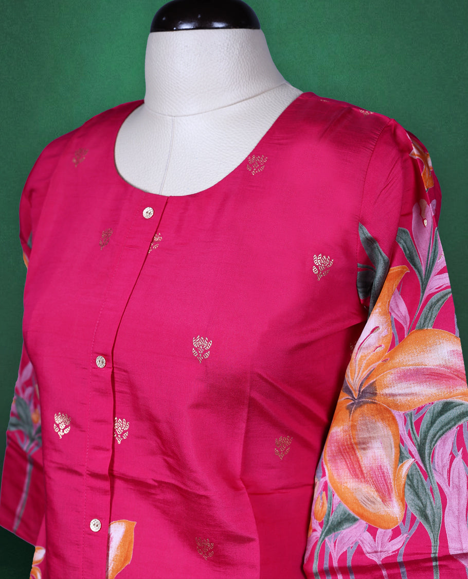 Fuchsia pink colour short kurti featuring a round neck and three quarter sleeves, adorned with vivid orange floral prints and minimal front buttons for a vibrant, breezy look.