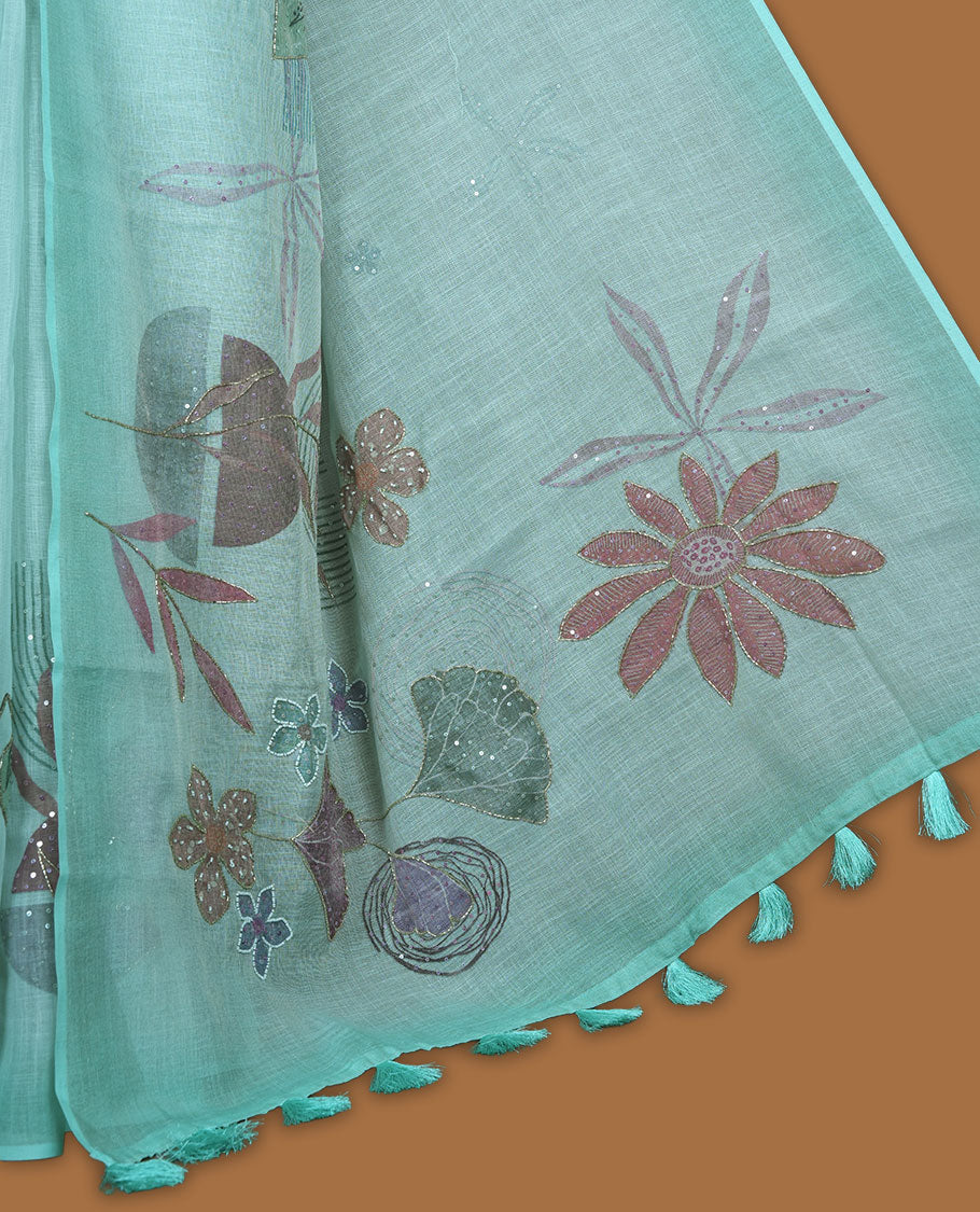 Light Blue colour Linen saree featuring Blue colour fade border with floral beats pattern around floral print across body without border, pallu and matching blouse piece.
