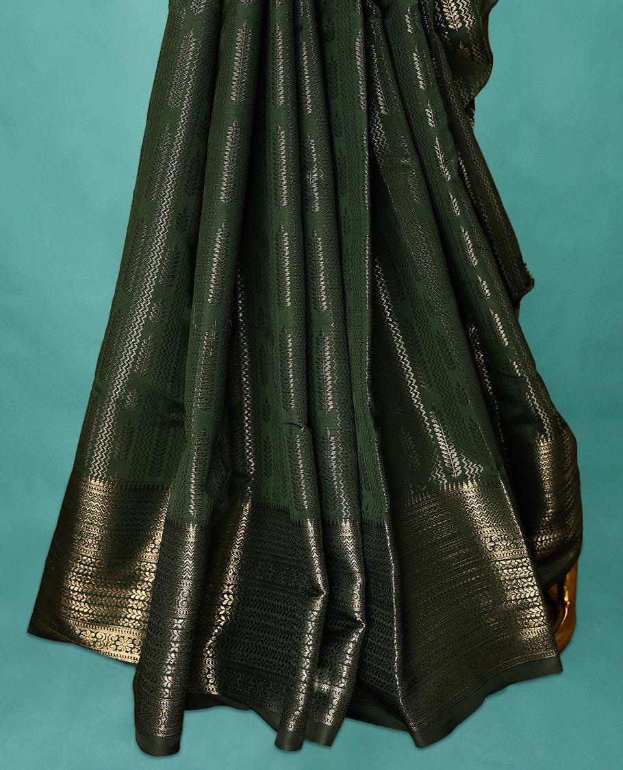 Dark Bottle Green Art Soft Silk Saree showcases intricate silver zari work on the body and border, paired with a matching blouse