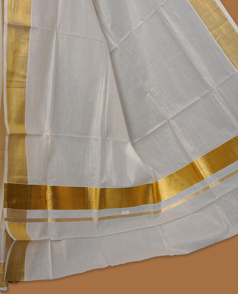 Off-white colour cotton Kerala saree crafted in a soft, sheer weave, finished with a classic rich gold kasavu border along the body and pallu, and paired with a matching blouse.
