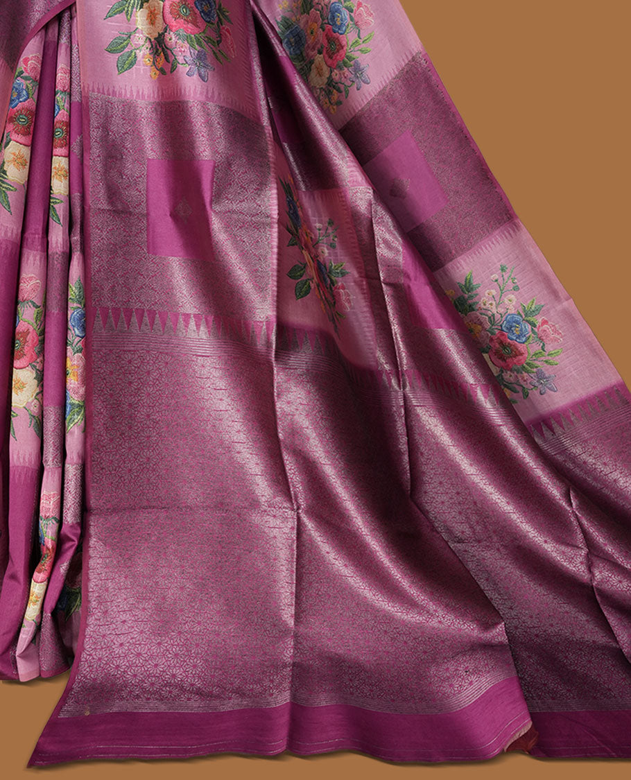 Grape colour semi tussar Banarasi saree featuring vibrant multi-color floral prints across the body, with geometric zari patterns, and a matching blouse detailed with silver woven buttas.