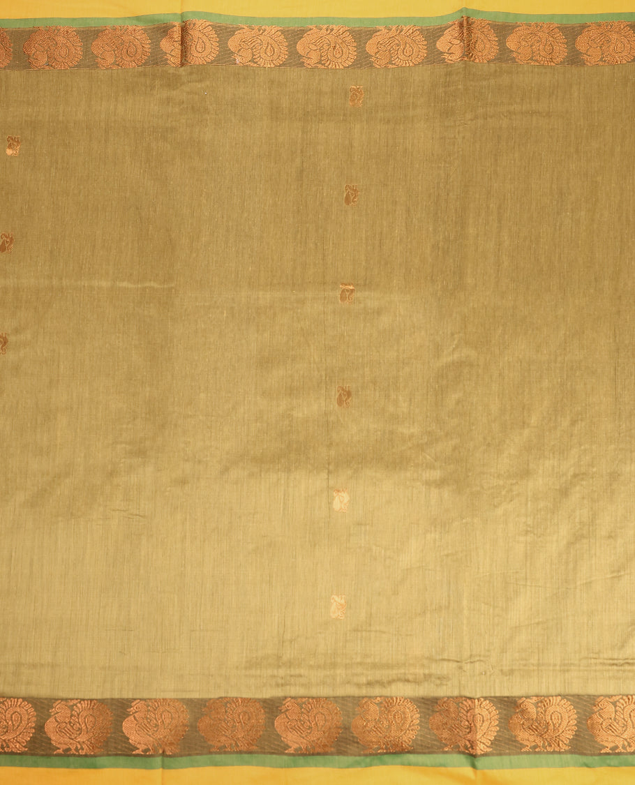 Olive Green and Maroon Kalyani cotton saree featuring subtle woven motifs on the body, accentuated with rich zari peacock designs on the border and pallu, paired with a matching blouse.