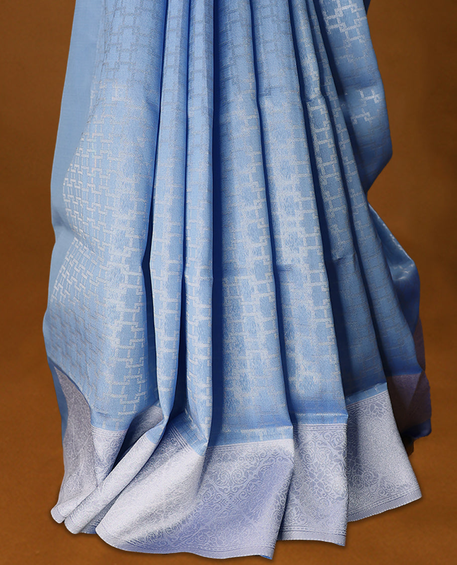 Pastel Blue coloured semi silk saree featuring a Silver coloured Zari design on the body, paired with a Lavender coloured border and blouse.