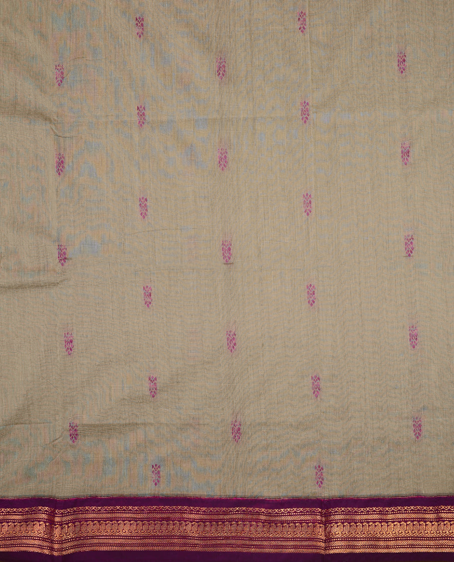 Grey colour mixed Kalyani cotton saree featuring Magenta zari Motifs throughout the body, paired with a Grape colour traditional border and pallu, with matching blouse