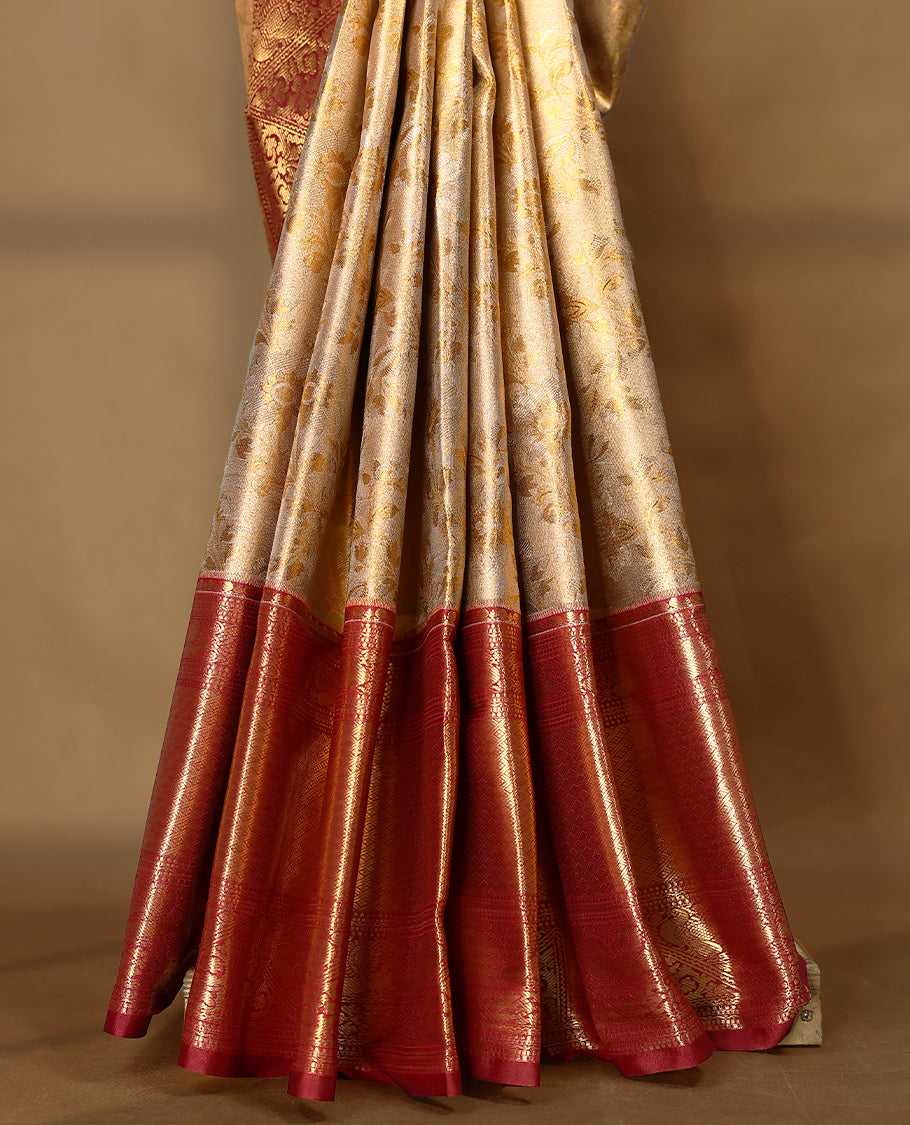 Gold colour tissue brocade saree with gold and silver zari floral design on body, gold zari peacock & Flower traditional work Maroon border, rich matching pallu with Antique zari motifs, paired with matching blouse.