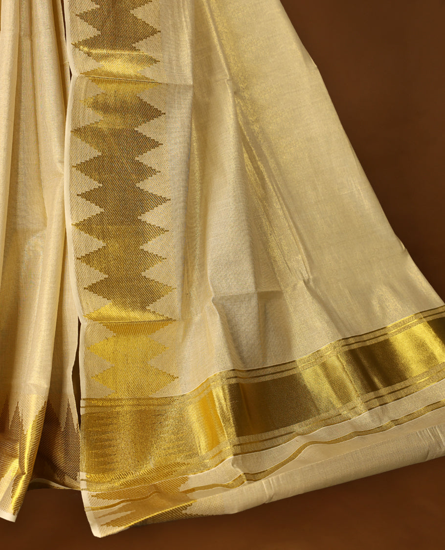 Light Gold colour Tissue Kerala saree featuring Plain body and a beautifully woven Gold Kasavu border with Diamond Patterns, paired with a matching blouse perfect for festive occasions.