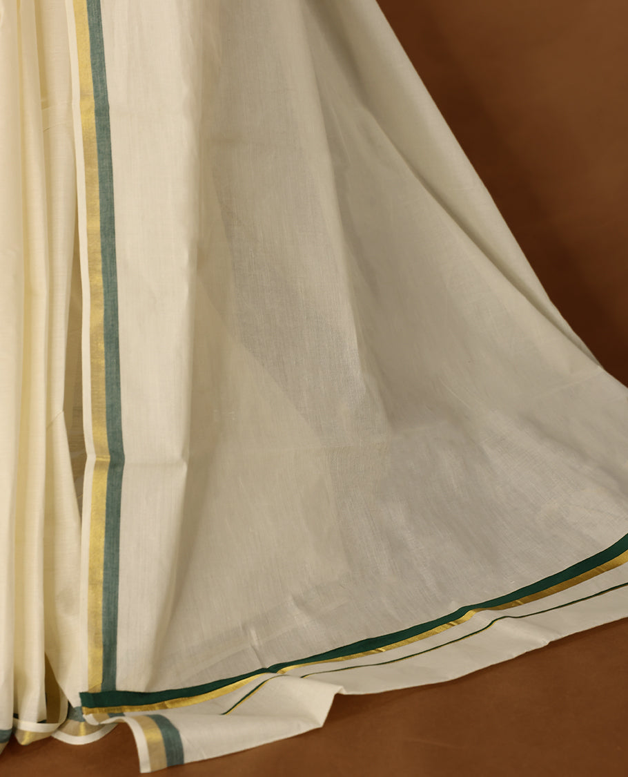Elegant off white colour cotton Kerala saree featuring a plain body and traditional golden zari border with a hint of Deep Green, offering a classic and graceful look, paired with a matching blouse.