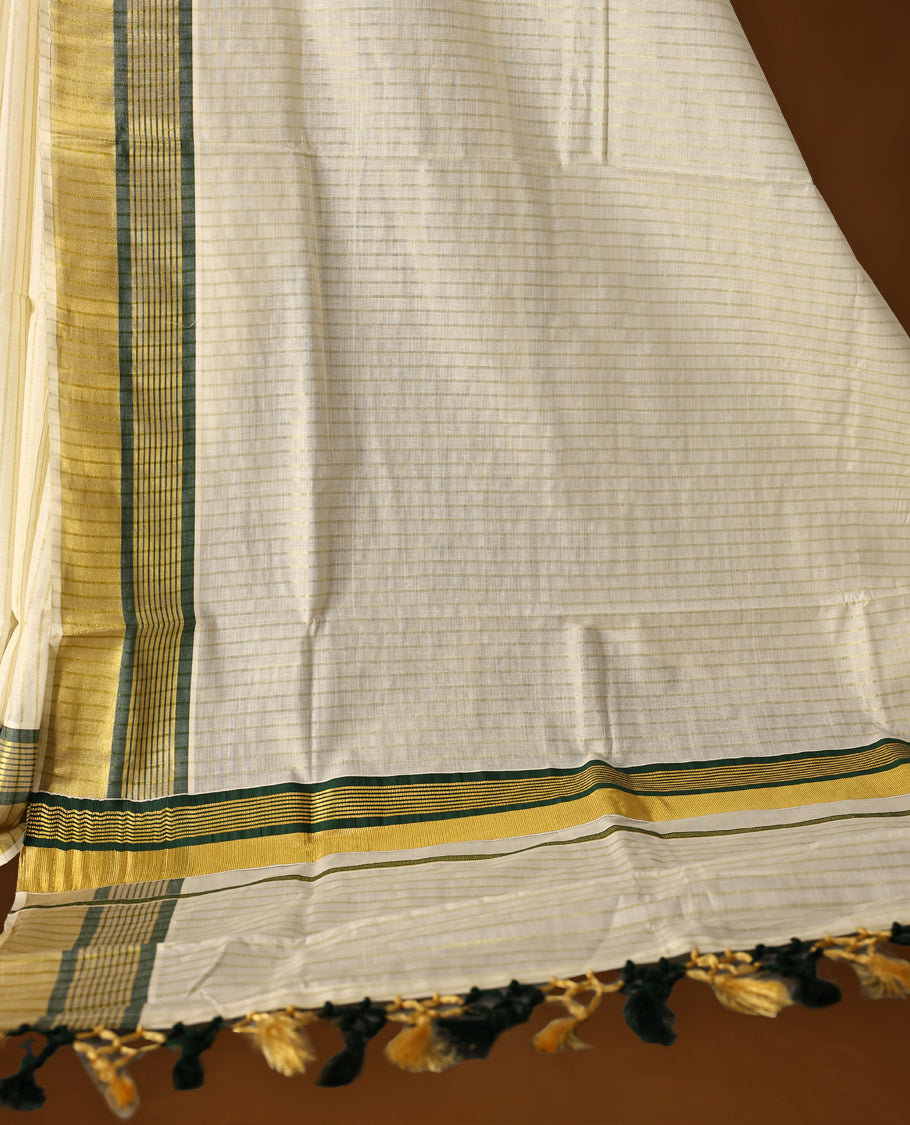 Elegant off white colour checked cotton Kerala saree with golden and green zari border, finished with tasselled pallu & Comes with a matching blouse, perfect for festive and traditional occasions.