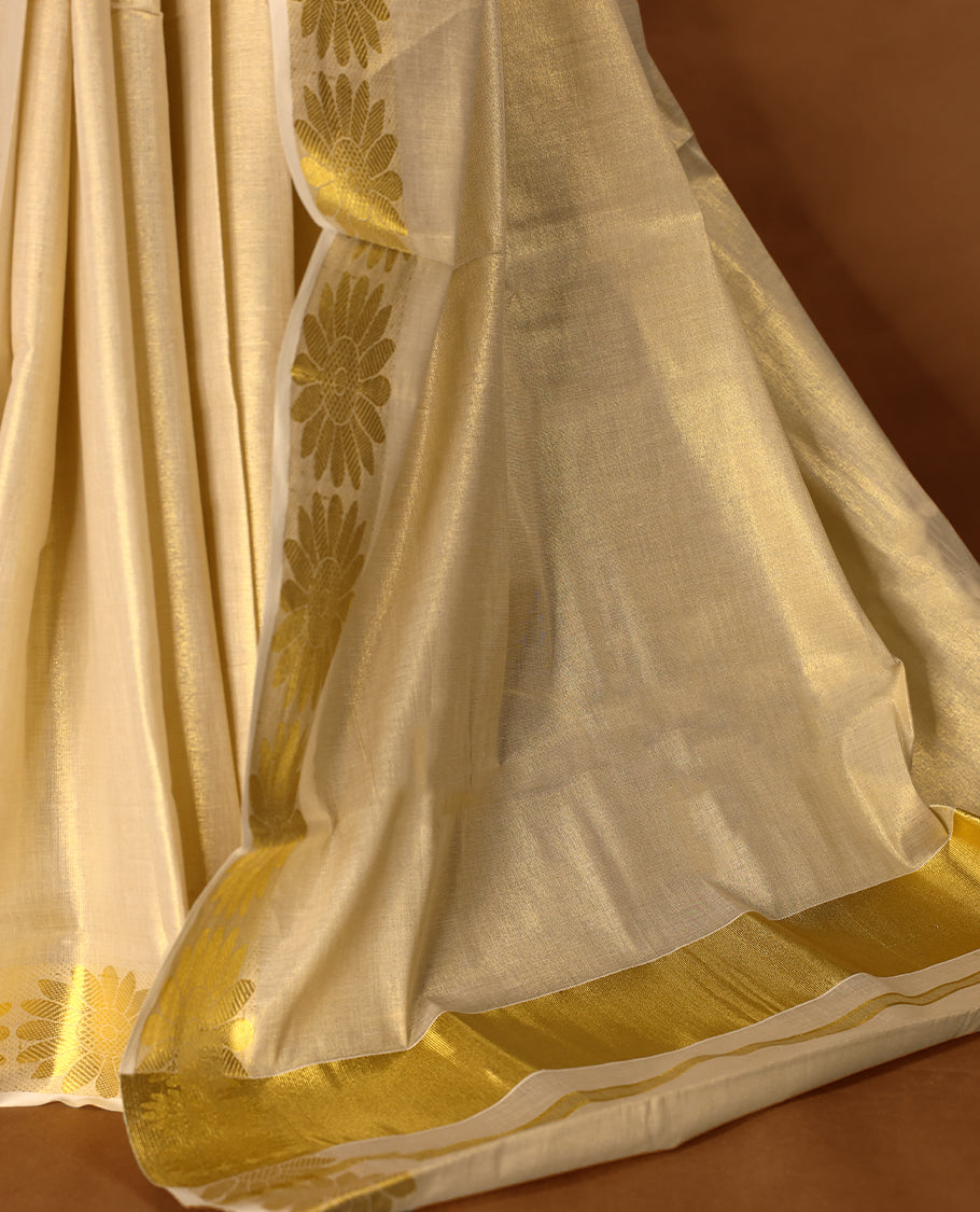 Light Gold colour Tissue Kerala saree featuring Plain body and a beautifully woven Gold Kasavu border with floral motifs, paired with a matching blouse perfect for festive occasions.