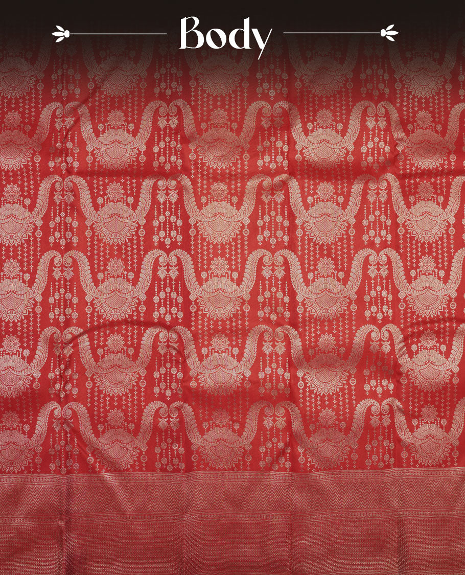 Cherry Red colour Kanchipuram pattern Manthrakodi saree featuring intricate geometric floral antique gold zari weaving design across the body, beautifully complemented with a matching self jaquard blouse piece.