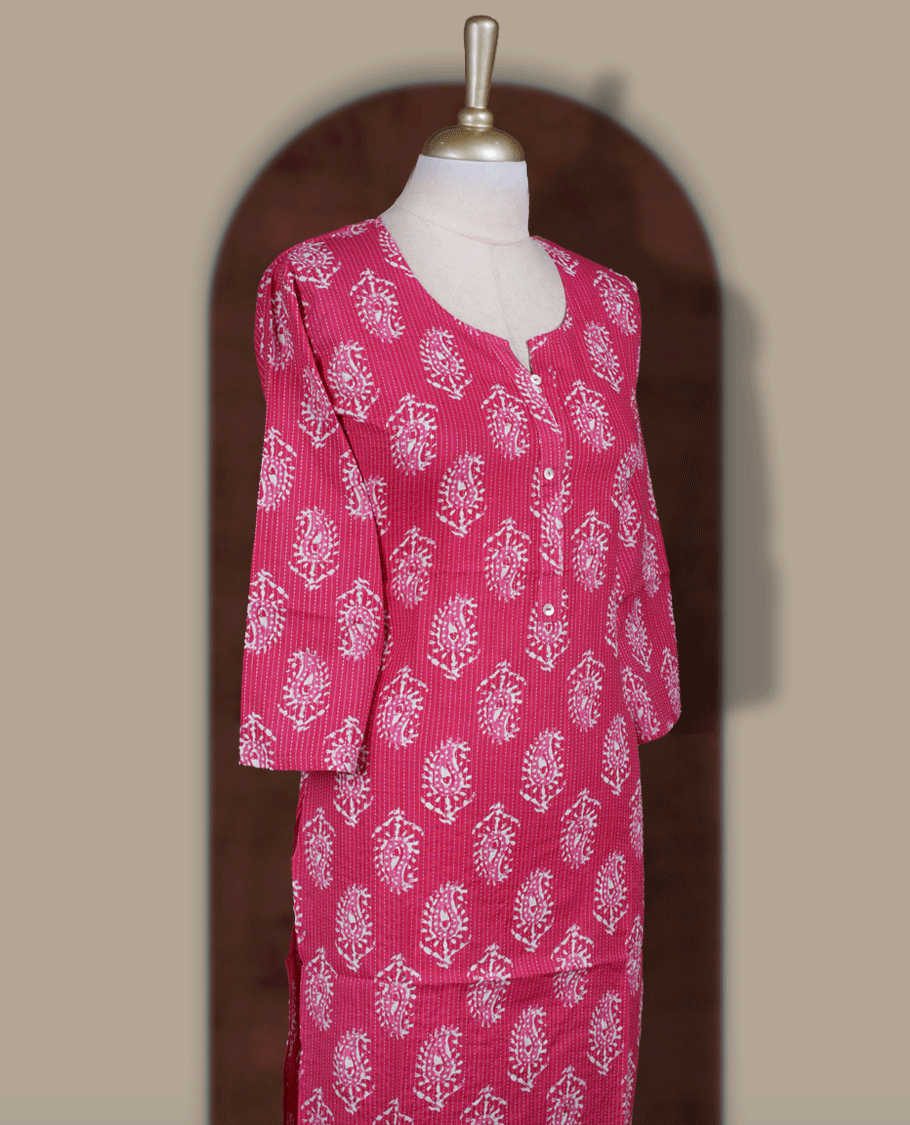 Magenta colour kurthi adorned with delicate white paisley prints, featuring a stylish V notch round neckline and comfy 3/4th sleeves & Designed in a straight cut silhouette for a graceful, everyday look.