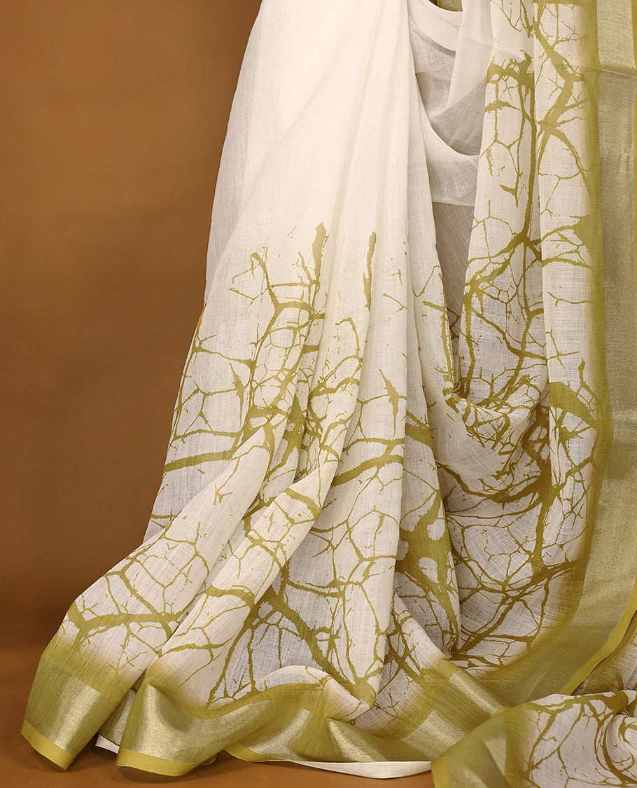 White cotton saree featuring light olive green abstract patterns and a soft matching border with Matching Blouse