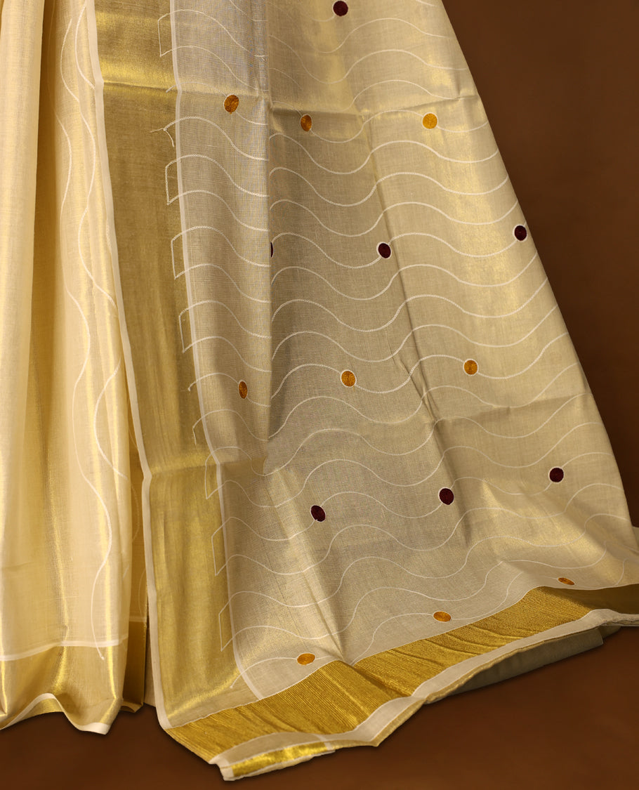 Light Gold colour Tissue Kerala saree featuring Thread work on the body and a beautifully woven Gold Kasavu border, paired with a matching blouse perfect for festive occasions.