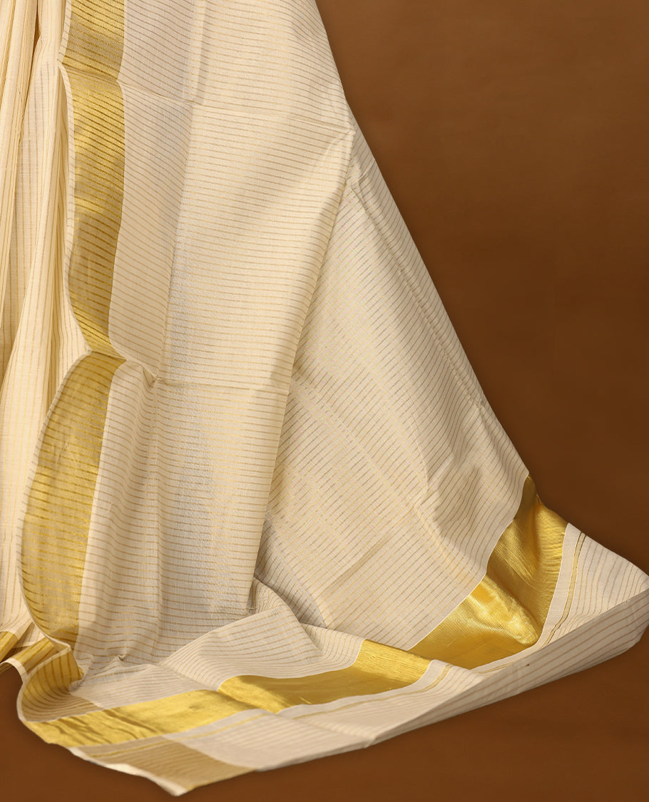 Kerala cotton saree with fine golden stripes and a Golden lustrous zari border with Matching Blouse