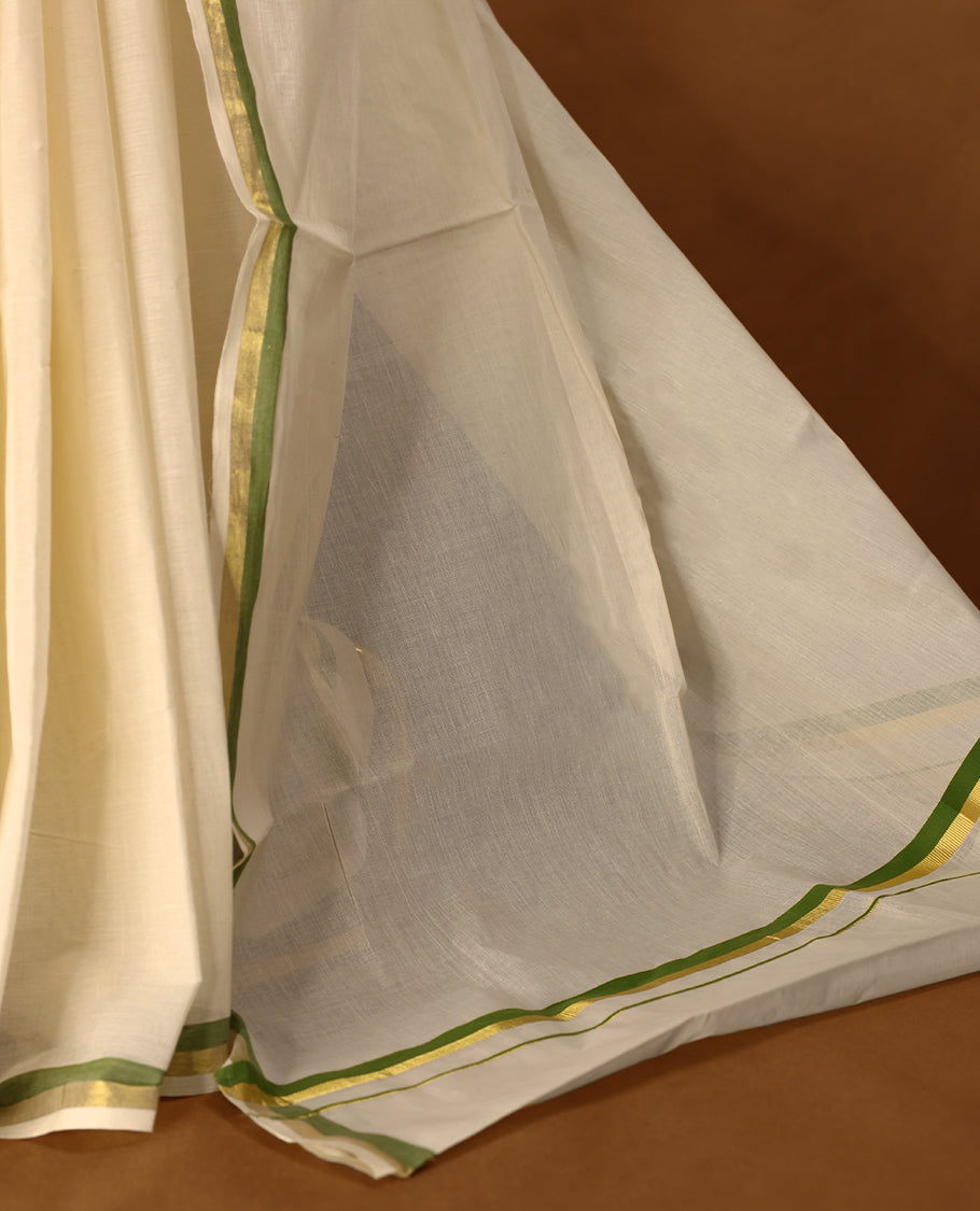 Elegant off white colour cotton Kerala saree featuring a plain body and traditional golden zari border with a hint of Olive Green, offering a classic and graceful look, paired with a matching blouse.