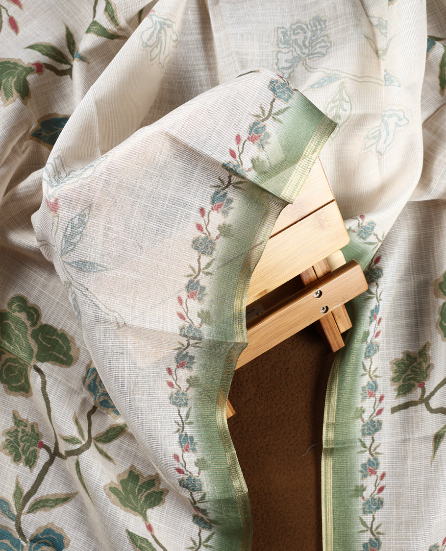 Beige & sage green colour churidhar material with floral print enhanced by sewn glass beads on the body, paired with plain lavender bottom & floral print dupatta.