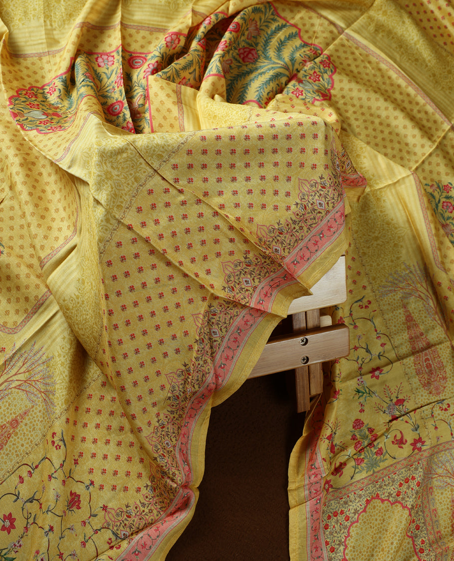 Yellow colour churidhar material with delicate floral embroidery on the neckline, complemented by a vibrant printed dupatta and plain bottom.