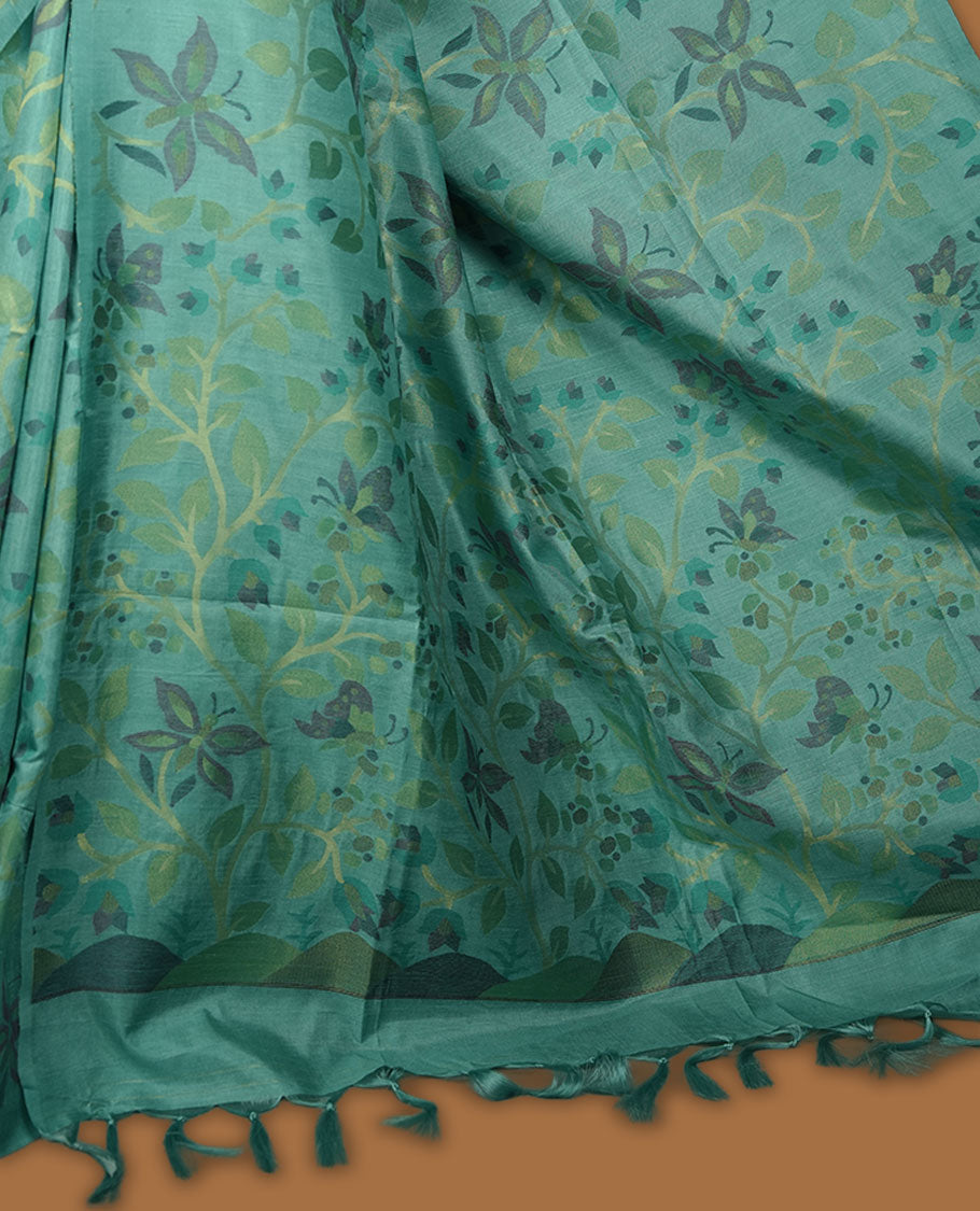 Mint colour semi tussar saree featuring woven Floral kodi & butterfly motifs on the body, complemented by a self colour without border pallu, paired with a matching blouse.