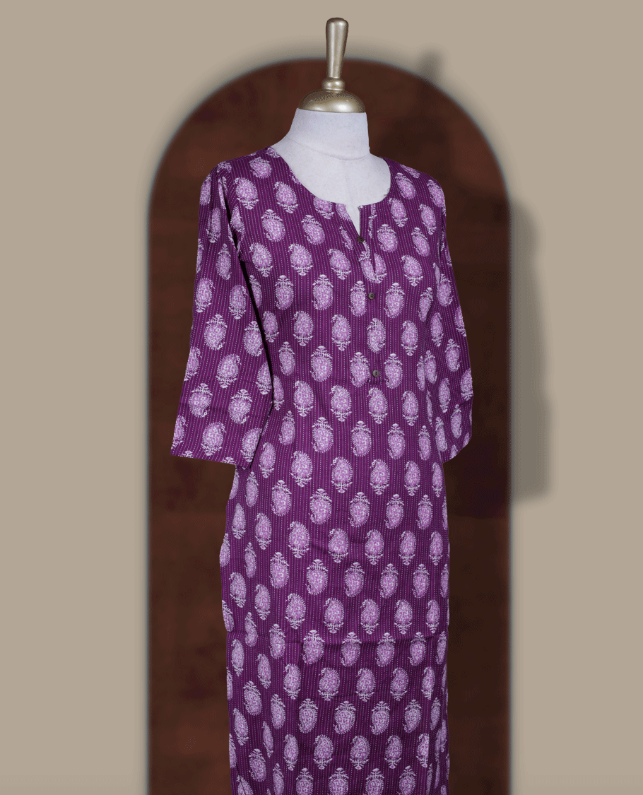 Purple colour kurthi adorned with delicate white paisley prints, featuring a stylish V notch round neckline and comfy 3/4th sleeves & Designed in a straight cut silhouette for a graceful, everyday look.