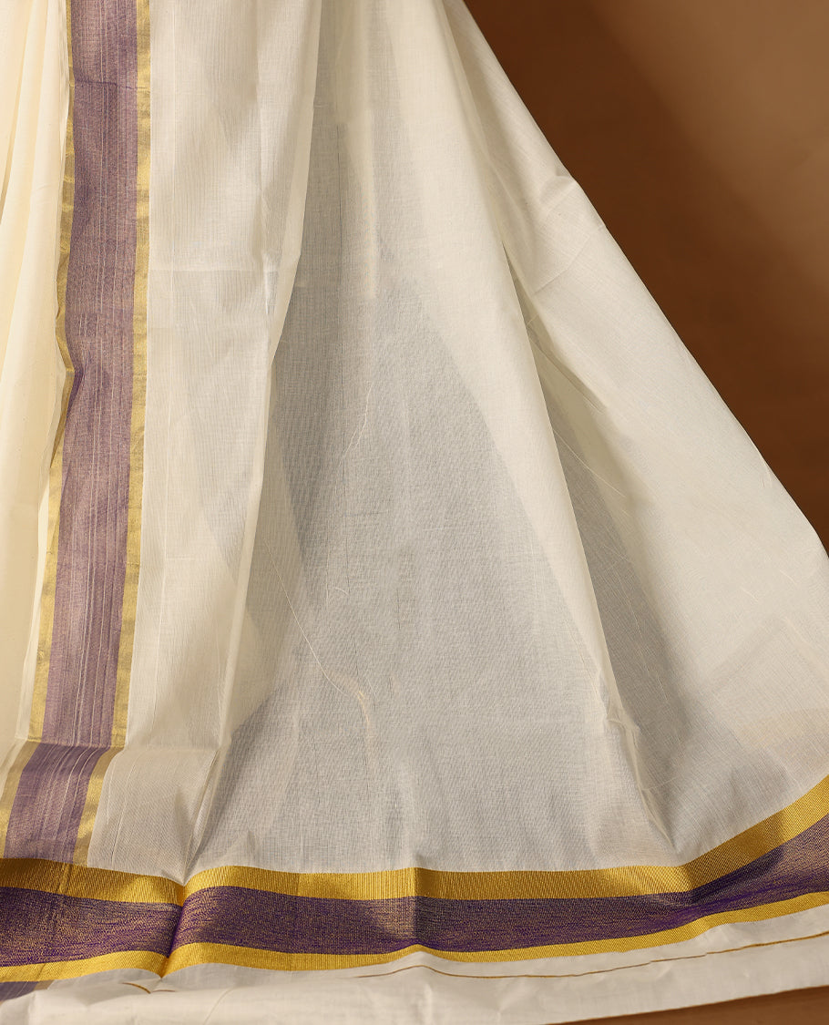 Elegant off white colour cotton Kerala saree featuring Plain body, Pastel purple & golden zari kasavu border offering a classic and graceful look, paired with a matching blouse.