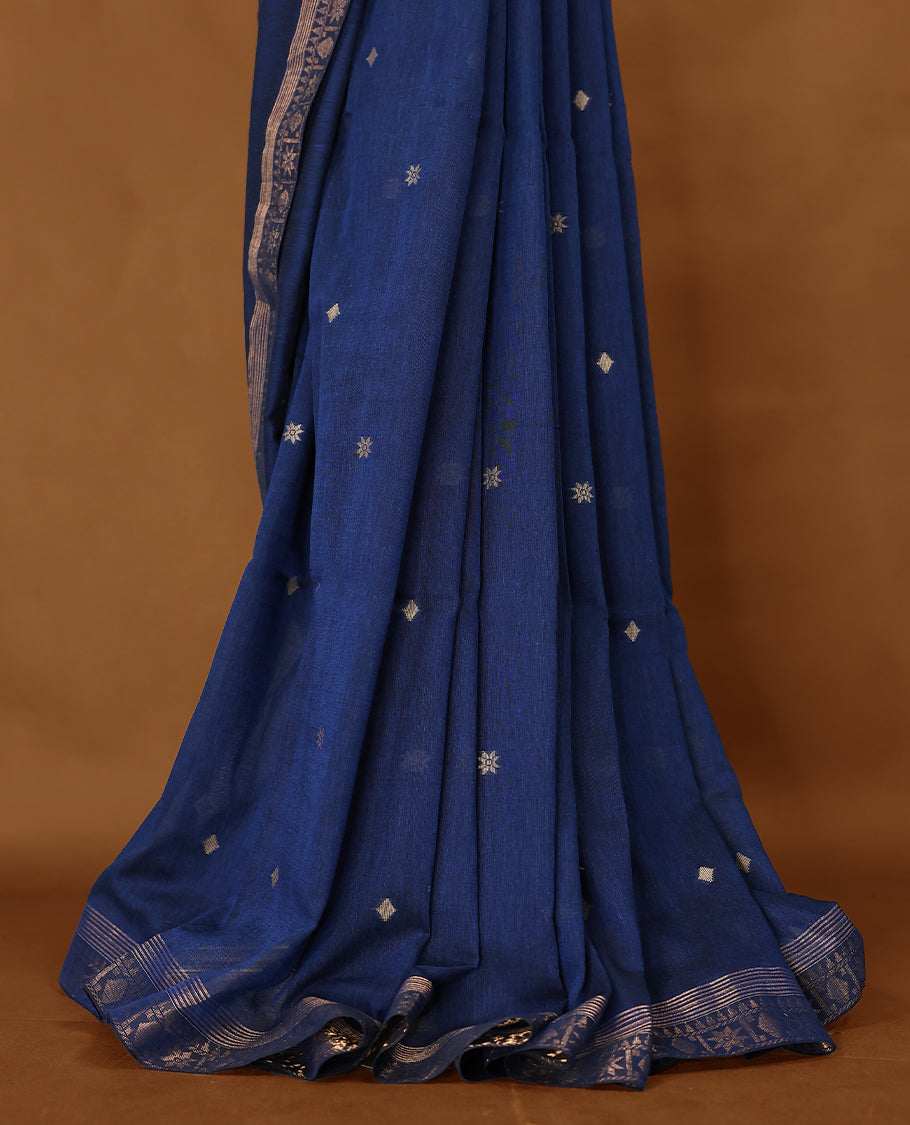 Deep Blue colour soft khadi cotton saree with Beige Zari motifs on the body, detailed woven Gold zari border, paired pallu with tussles, with matching blouse.