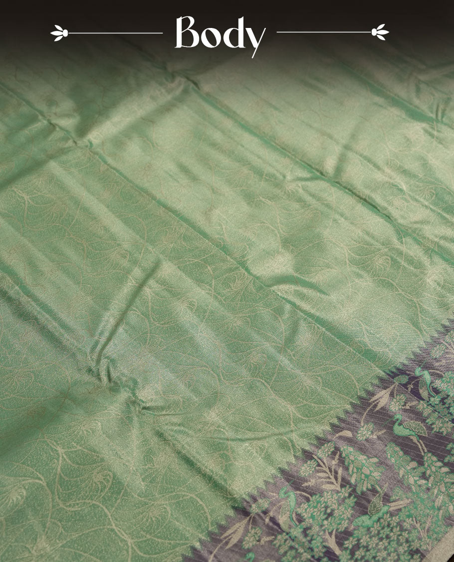 Aqua green colour and Antique gold Zari Tissue Brocade Saree features intricate Motifs on body and pastel purple colour fancy border & pallu with forest patterns, paired with matching blouse
