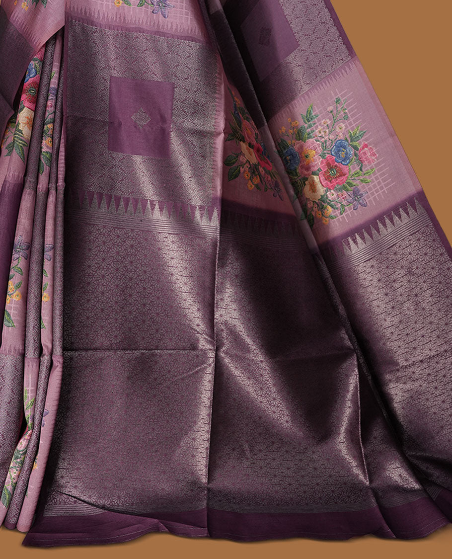 Grape color semi tussar Banarasi saree featuring vibrant multi-color floral prints across the body, with shimmering geometric zari patterns, a rich gray-red border, and a matching blouse detailed with silver woven buttas.