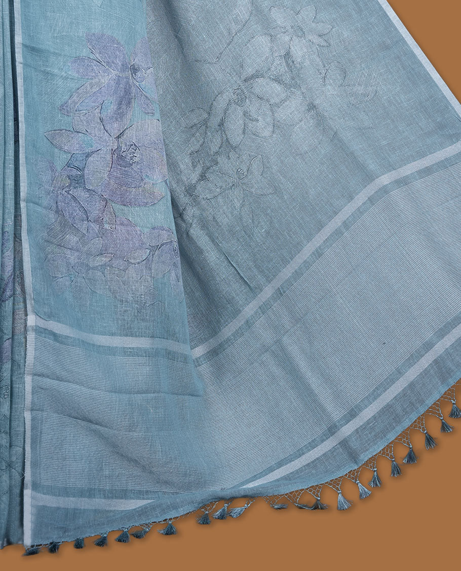 Ice blue colour pure linen saree featuring Floral print pattern across body, silver thin border finished with matching blouse.