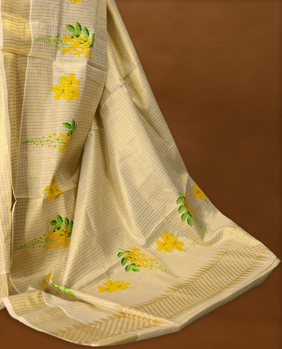 Kerala tissue saree with bright yellow floral motifs and a soft golden Border with Matching Blouse