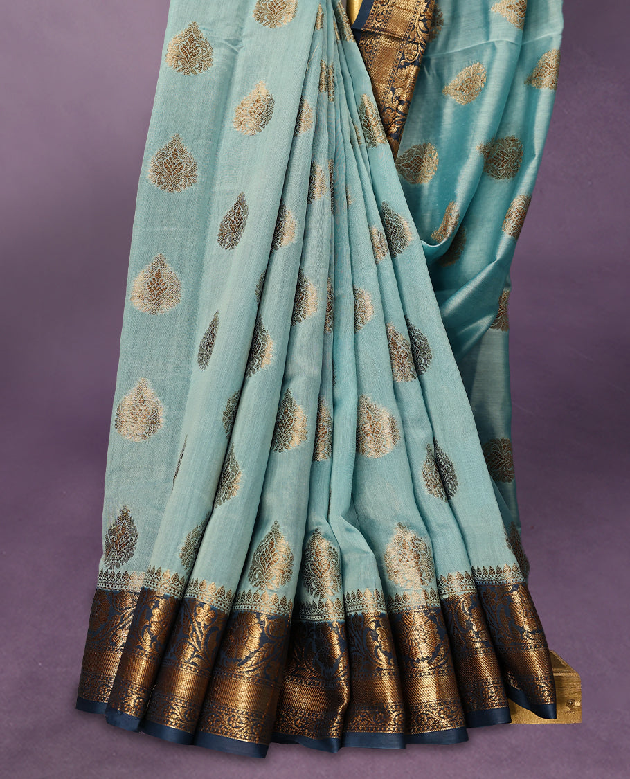 Sky Blue colour pure Banarasi Chanderi cotton fabric, featuring traditional antique zari buttas on the body, complemented by a traditional Indigo Blue Colour border and a matching blouse.