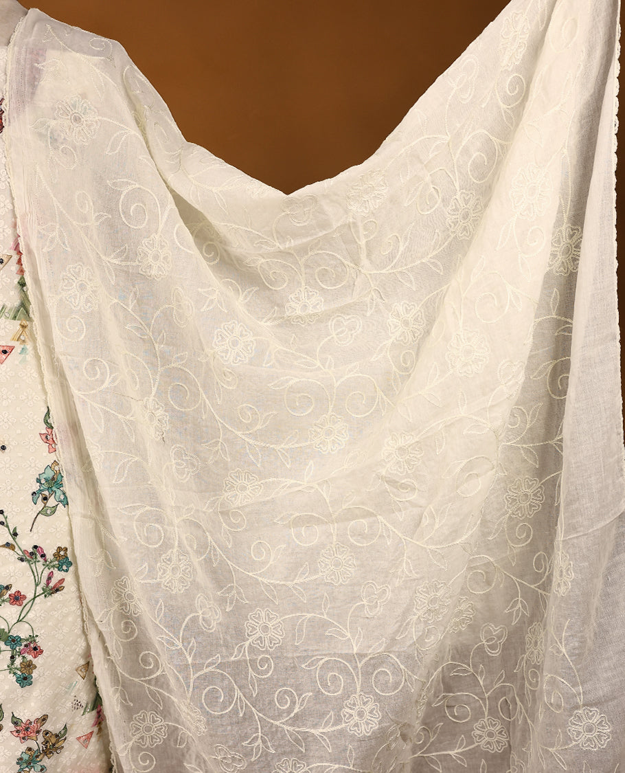 Off-white threadwork top with multi-colour prints and red border, paired with a bottom and an embroidered dupatta.