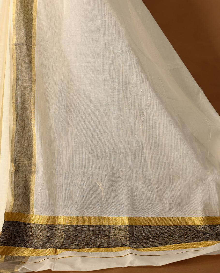 Elegant off white colour cotton Kerala saree featuring Plain body, Muted Black & golden zari kasavu border offering a classic and graceful look, paired with a matching blouse.