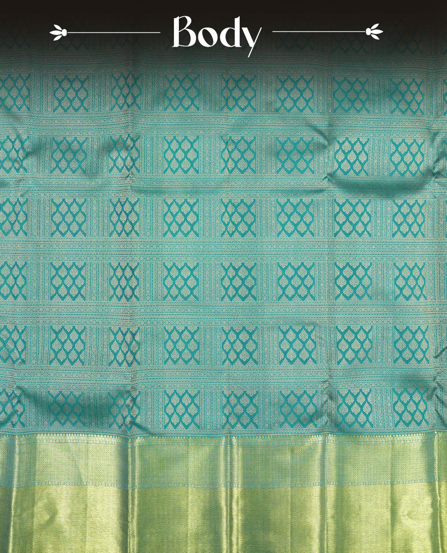 Turquoise blue colour Kanchipuram pattern Manthrakodi saree featuring golden zari box jacquard with small zari motifs across the body, traditional zari border, zigzag bavanji detailing, and plain zari blouse piece.