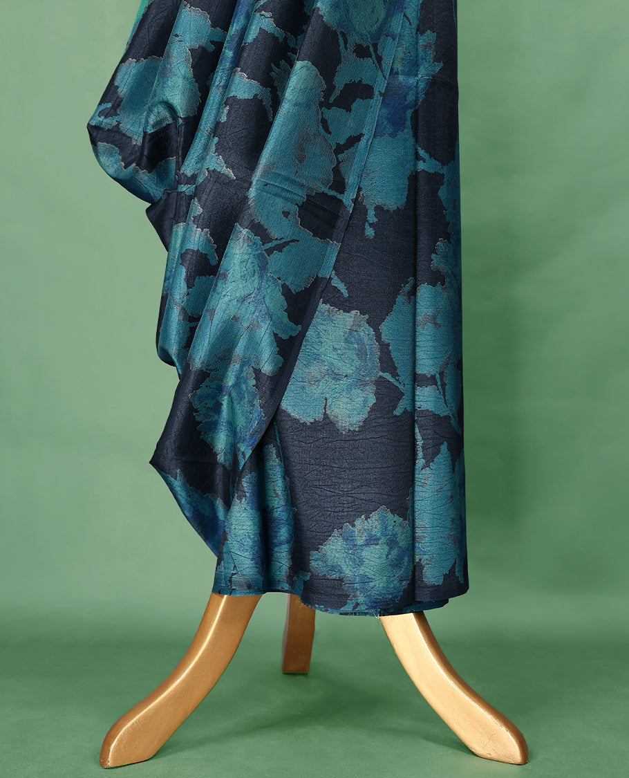 Midnight blue colour Manipuri saree featuring oversized teal floral motifs, finished without a border, and paired with a matching blouse.