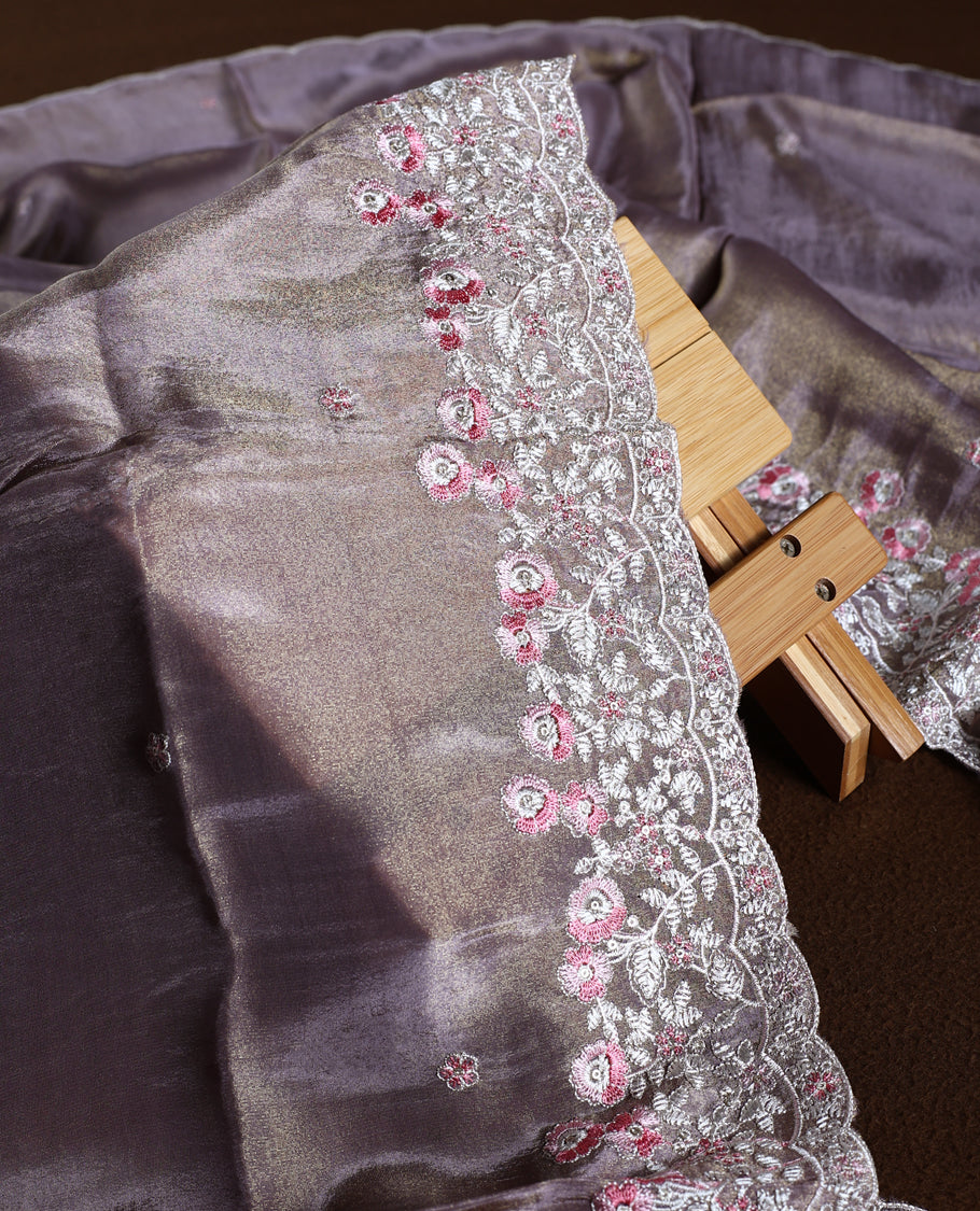 Mauve colour churidhar material with a soft sheen, adorned with pink and white floral lace embroidery & Comes with a plain matching bottom and dupatta.