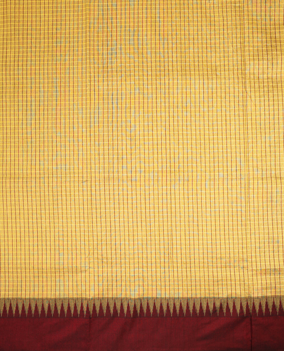 Antique Gold colour mixed Kalyani cotton saree featuring Mustard & Maroon checks throughout the body, paired with a maroon colour traditional border and pallu, with matching blouse