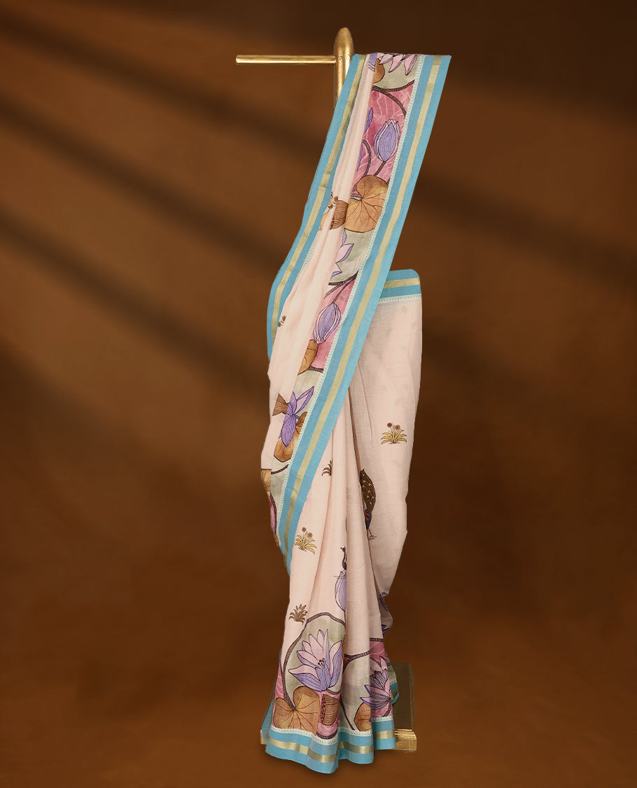 Off-white Colour lightweight khadi cotton saree featuring earthy-coloured digital floral kodi prints on the body and pallu, accented with a Blue border paired with a matching blouse.