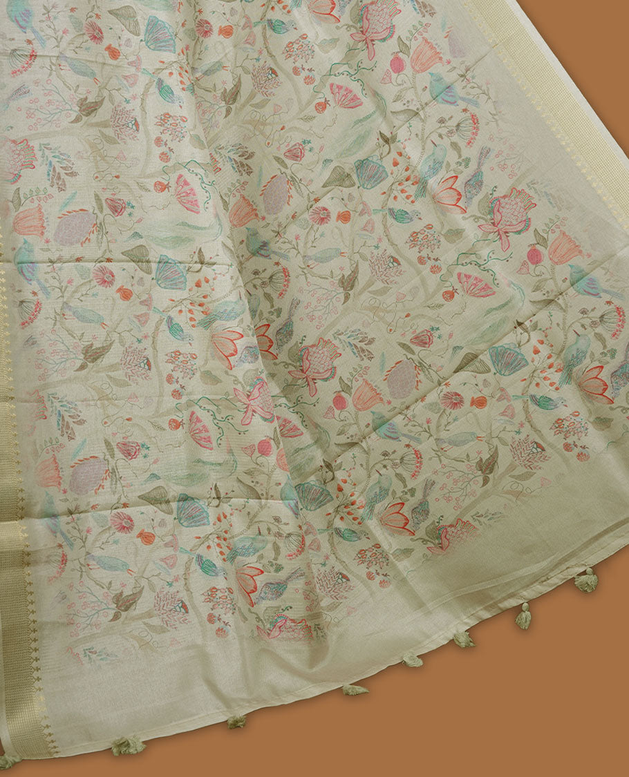 Light green colour semi tussar silk saree featuring all over floral and leaf motifs on the body with a subtle self border and tasselled pallu, paired with a matching blouse.